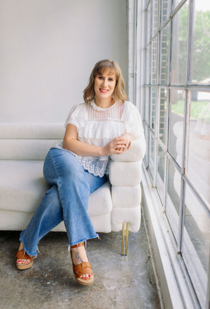 Why Your Baby or Toddler Isn’t Sleeping — Take the Free Sleep Quiz | Otterly Thriving Cute girl sitting near a window with natural light wearing jeans and a white top that is a sleep consultant near me.